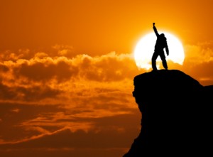 Man on top of mountain